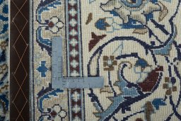 Backside of handmade 2000s Nain rug showing knot structure and weave density