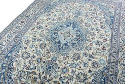 Backside of handmade 2000s Nain rug showing knot structure and weave density