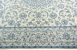 Corner detail of New Nain rug showing border pattern and Wool pile