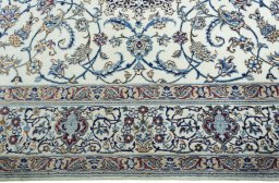 Corner detail of 2000s Nain rug showing border pattern and Wool pile