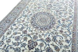 Backside of handmade 2000s Nain rug showing knot structure and weave density
