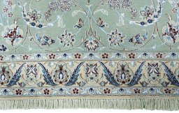 Close-up detail of New Nain rug from Iran / Persia showing Wool weave