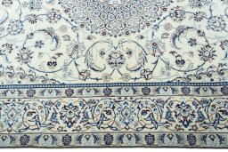 Corner detail of 2000s Nain rug showing border pattern and Wool pile