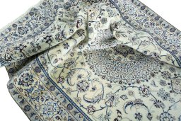 Surface texture of 2000s Nain rug with natural Wool and intricate pattern