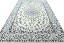 Surface texture of 2000s Nain rug with natural Wool and intricate pattern
