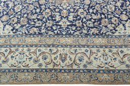 Corner detail of 2000s Nain rug showing border pattern and Wool pile