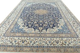Surface texture of 2000s Nain rug with natural Wool and intricate pattern