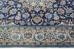 Corner detail of 2000s Nain rug showing border pattern and Wool pile
