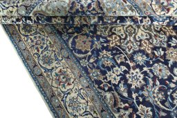 Close-up detail of 2000s Nain rug from Iran / Persia showing Wool weave