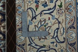 Backside of handmade 2000s Nain rug showing knot structure and weave density