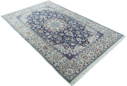 Close-up detail of 2000s Nain rug from Iran / Persia showing Wool weave