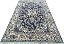 Surface texture of 2000s Nain rug with natural Wool and intricate pattern