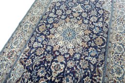 Backside of handmade 2000s Nain rug showing knot structure and weave density