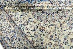 Close-up detail of 2000s Nain rug from Iran / Persia showing Wool weave