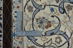 Backside of handmade 2000s Nain rug showing knot structure and weave density
