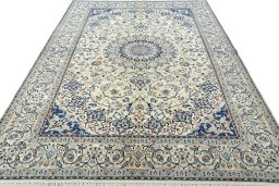 Surface texture of 2000s Nain rug with natural Wool and intricate pattern