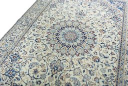 Backside of handmade 2000s Nain rug showing knot structure and weave density