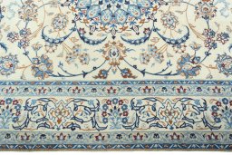 Corner detail of 2000s Nain rug showing border pattern and Wool pile