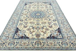 Surface texture of 2000s Nain rug with natural Wool and intricate pattern