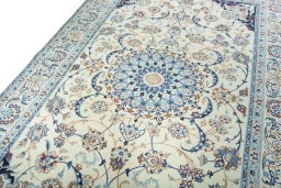 Backside of handmade 2000s Nain rug showing knot structure and weave density
