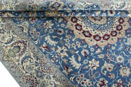 Close-up detail of 2000s Nain rug from Iran / Persia showing Wool weave