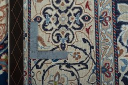 Backside of handmade 2000s Nain rug showing knot structure and weave density