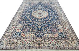 Surface texture of 2000s Nain rug with natural Wool and intricate pattern