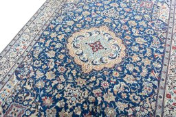 Backside of handmade 2000s Nain rug showing knot structure and weave density