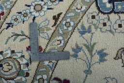 Corner detail of New Nain rug showing border pattern and Wool pile