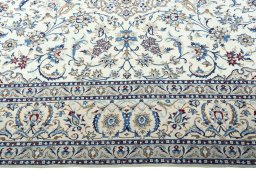 Corner detail of New Nain rug showing border pattern and Wool pile