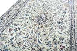 Backside of handmade New Nain rug showing knot structure and weave density
