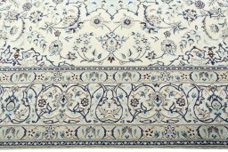Corner detail of 2000s Nain rug showing border pattern and Wool pile