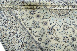 Close-up detail of 2000s Nain rug from Iran / Persia showing Wool weave