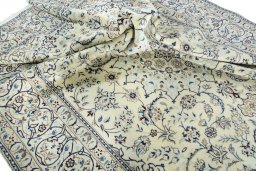 Surface texture of 2000s Nain rug with natural Wool and intricate pattern