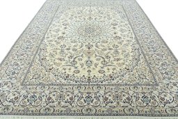 Surface texture of 2000s Nain rug with natural Wool and intricate pattern