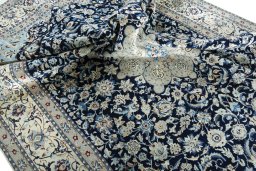 Surface texture of 2000s Nain rug with natural Wool and intricate pattern