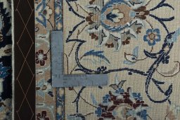 Backside of handmade 2000s Nain rug showing knot structure and weave density