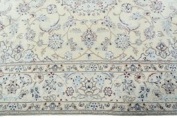 Corner detail of 2000s Nain rug showing border pattern and Wool pile