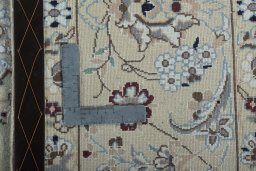 Backside of handmade 2000s Nain rug showing knot structure and weave density