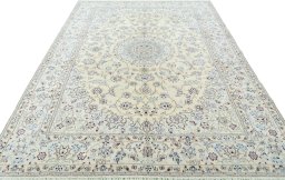 Surface texture of 2000s Nain rug with natural Wool and intricate pattern
