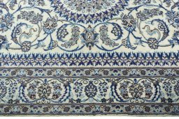 Corner detail of New Nain rug showing border pattern and Wool pile