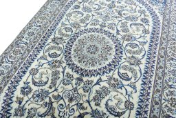 Backside of handmade New Nain rug showing knot structure and weave density