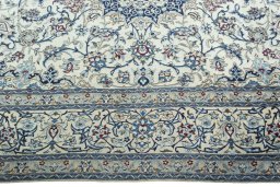 Corner detail of 2000s Nain rug showing border pattern and Wool pile