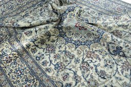Surface texture of 2000s Nain rug with natural Wool and intricate pattern