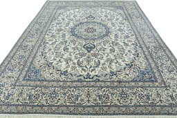 Surface texture of 2000s Nain rug with natural Wool and intricate pattern