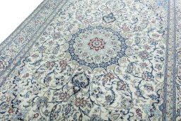 Backside of handmade 2000s Nain rug showing knot structure and weave density