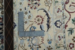 Backside of handmade New Nain rug showing knot structure and weave density