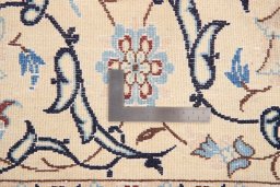 Surface texture of 1990s Nain rug with natural Wool and intricate pattern