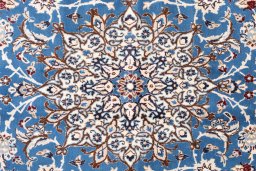 Corner detail of 1985s Nain rug showing border pattern and Wool pile