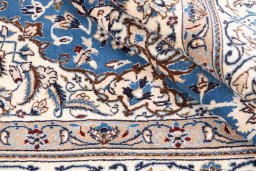 Close-up detail of 1985s Nain rug from Iran / Persia showing Wool weave
